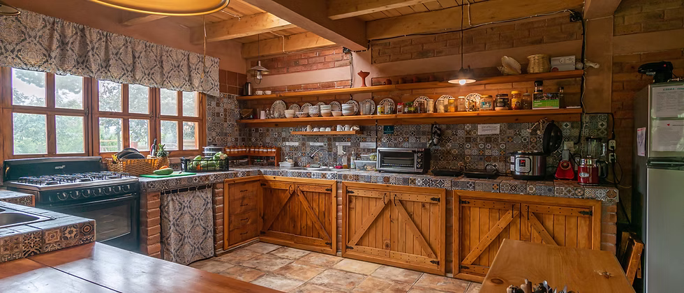 The communal kitchen, tiled counters and wood cabinets