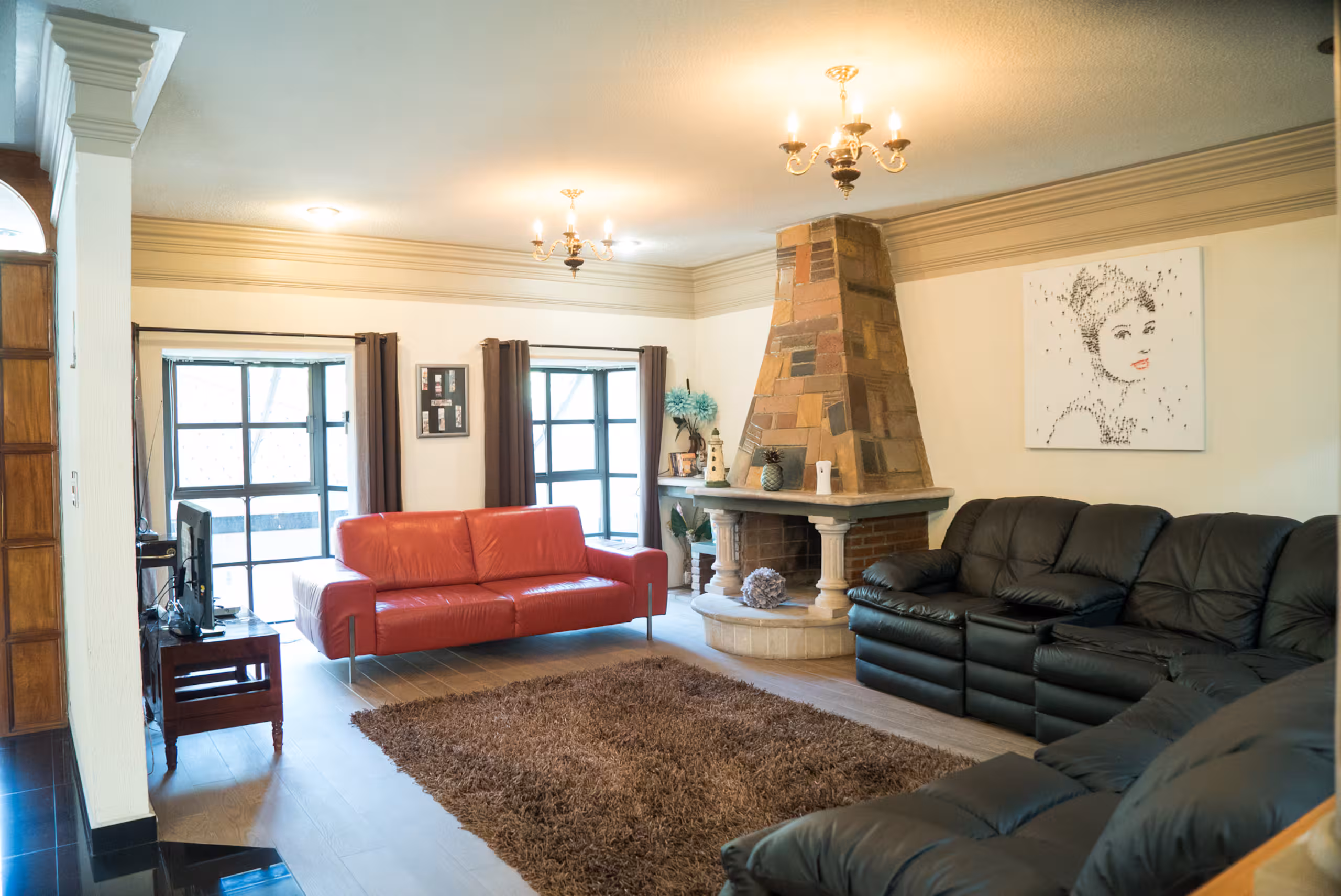 Living room fireplace and art in the Morelia home